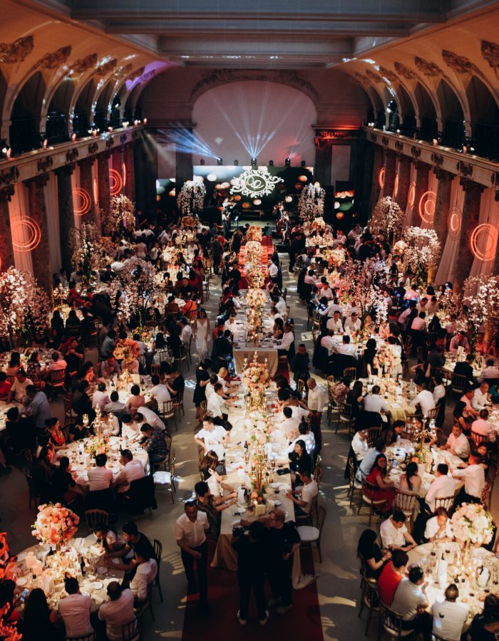 round tables in celebration hall with full of guests